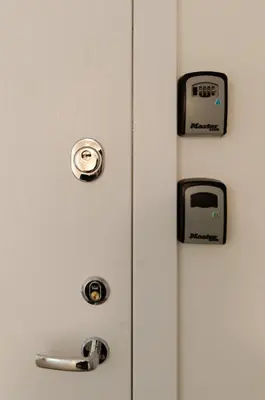 a refrigerator with magnets and a clock on it at City Studio 1B in a great location in Vilnius
