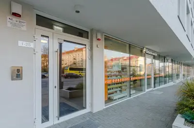 a row of glass windows on a building at City Studio 1A - Courtyard View in Vilnius