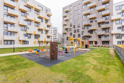 a playground in front of a apartment building at Apartments Vilnius 1 near center with a roof terrace and parking in Vilnius