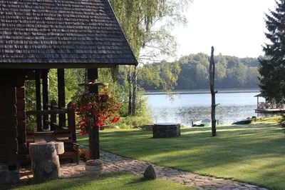a cabin with a view of a lake at Prie Klykio in Utena