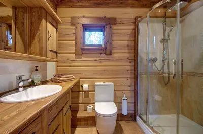 a bathroom with a toilet sink and a shower at Prie Klykio in Utena