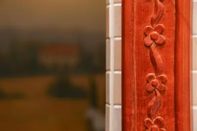 a close up of a wooden door with flowers on it at Pažaislis Park Hotel in Kaunas