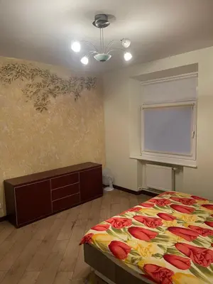 a bedroom with a bed and a window at Gintautas apartment in Šiauliai