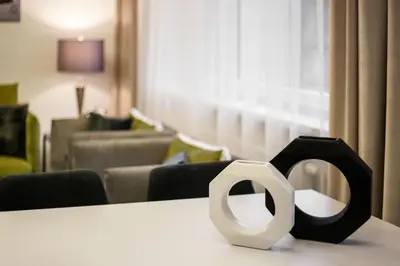 a white and black object sitting on top of a table at Luxury for everyone - Hills Park Lux Apartments 2 in Vilnius