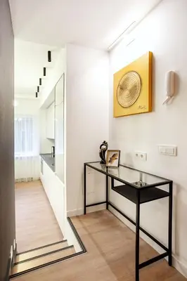 a room with a glass table and a hallway at Luxury for everyone - Hills Park Lux Apartments 2 in Vilnius
