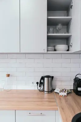 a kitchen counter with a tea kettle on top of it at J14A I Rooms & Apartments AUTOMATED SELF CHECK-IN in Vilnius