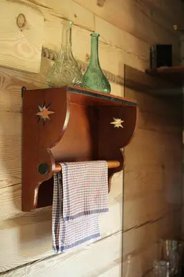 two glass vases on a shelf on a wall at Sodyba pas Olgą in Mickūnai