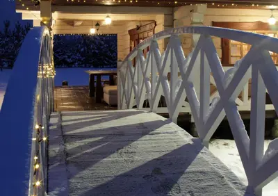 a stairway leading to a porch with a white fence at Sodyba pas Olgą in Mickūnai