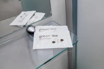 a green tea sign on a drawer in a room at Silvija House in Vilnius