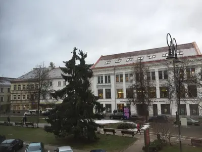 a large building with a christmas tree in front of it at Town Hall Apartments in Vilnius