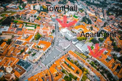an aerial view of a city with orange buildings at Town Hall Apartments in Vilnius