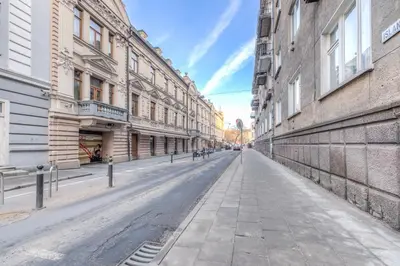 an empty street in a city with buildings at Islandijos gatvė in Vilnius