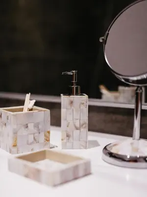 a mirror and two soap dispensers on a counter at Islandijos gatvė in Vilnius