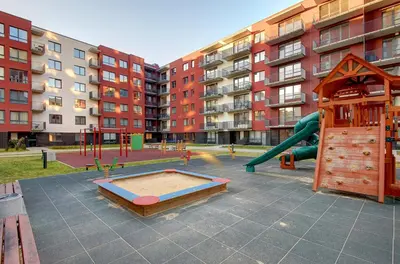 an empty playground with a slide and a slideintend at Kauno-Algirdo Luxury apartments in Vilnius