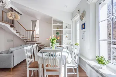 a dining room with a table and chairs at 3 Bedroom Apartment 24h self check in, free parking, Ac, fireplace in Vilnius