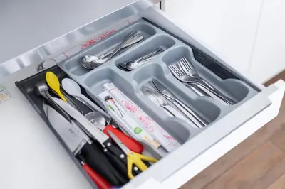 a drawer filled with utensils in a drawer at 3 Bedroom Apartment 24h self check in, free parking, Ac, fireplace in Vilnius
