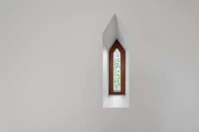 a window in the side of a white building at BURMISTRO NAMAS in Druskininkai