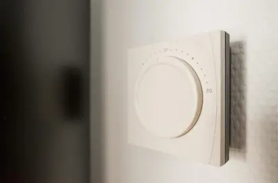 a white microwave door with a round window on it at Laurentroom Park&Fountain in Ukmergė