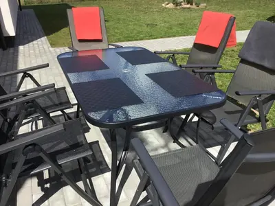 a blue table and chairs on a patio at Radvi House in Druskininkai