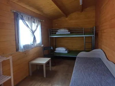 a small room with a bunk bed and a window at Biržai camping in Biržai