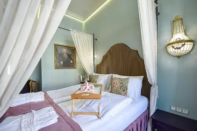 a bedroom with a bed with a table on it at Inner Blossom in Kaunas