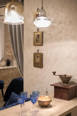 a table with wine glasses and a bowl on it at Luxury apartment in Pilies street in Vilnius