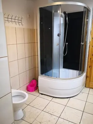a bathroom with a shower and a toilet at Kambario nuoma su bendru vonios kambariu in Kaunas