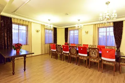 a conference room with red chairs and a table at Spa Villa Trakai in Trakai