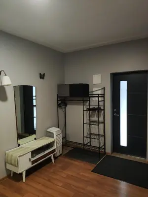 a room with a bedroom with a bed and a mirror at Old Slabada Apartments in Kaunas