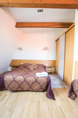 a bedroom with a bed in a room at Apartments Ameda in Vilnius