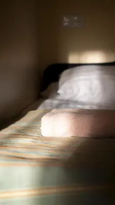 a close up of a bed in a bedroom at Hotel Vita in Druskininkai