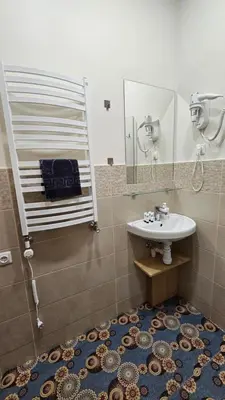 a bathroom with a sink and a mirror at Nileja in Vilnius