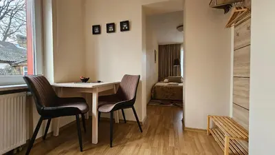 a small room with a table and two chairs at Nileja in Vilnius