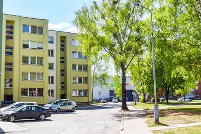a street light in a parking lot in front of a building at Crystal Apartment in Druskininkai