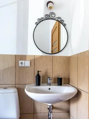a bathroom with a sink and a mirror at Aušra in Druskininkai