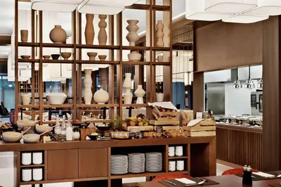a kitchen with lots of vases and bowls on display at Hilton Garden Inn Vilnius City Centre in Vilnius