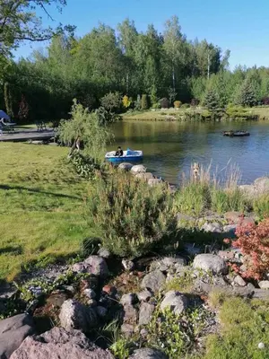 a couple of people in a boat on a river at Residence R&R in Karvys