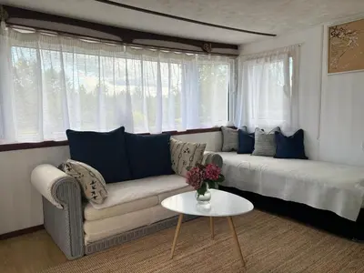 a living room with a couch and a table at Residence R&R in Karvys
