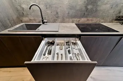 a kitchen with a sink and a counter with utensils at City Center Loft 2 in Kaunas