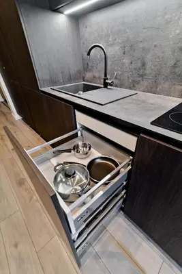 a kitchen with a sink with pots and pans at City Center Loft 2 in Kaunas