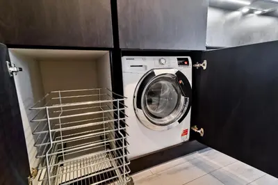 a washer and dryer in a laundry room at City Center Loft 2 in Kaunas
