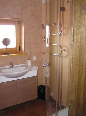 a bathroom with a sink and a shower at sodyba 