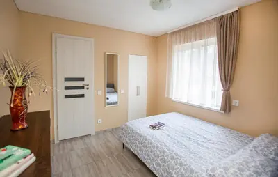 a bedroom with a bed and a window at Chill&Go Apartment in Kaunas