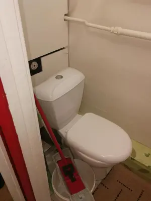 a bathroom with a white toilet in a room at Flat, 1 room, study in Panevėžys