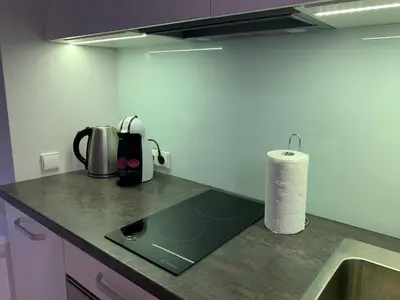 a kitchen with a counter top with a sink at Bright 1BD Apartment in Old Town by Hostlovers in Kaunas