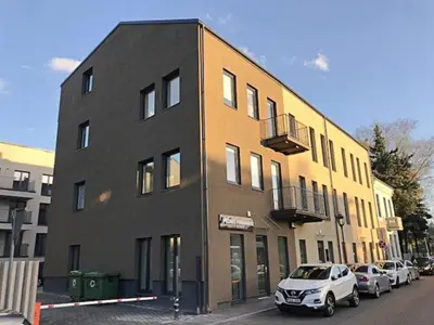 a white car parked in front of a building at Bright 1BD Apartment in Old Town by Hostlovers in Kaunas