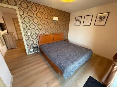 a bedroom with a bed in a room at EVArent Apartament Free parking in Vilnius