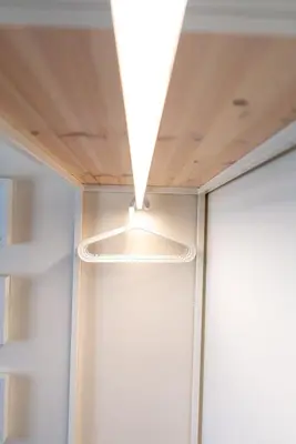 a ceiling light in a room with white walls at Mai Ram Yoga House in Vilnius