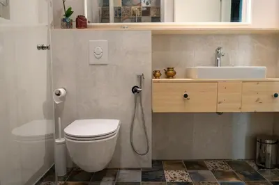 a bathroom with a toilet and a sink at Mai Ram Yoga House in Vilnius