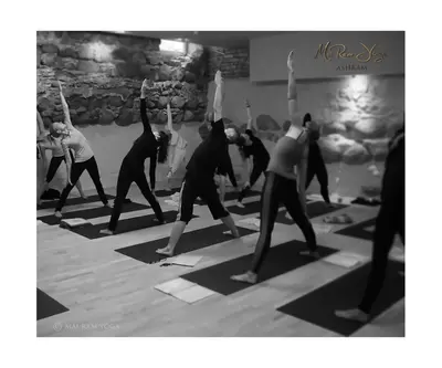 a group of people in a yoga class at Mai Ram Yoga House in Vilnius